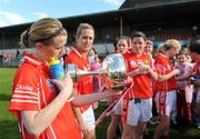4 May 2008; Cork's Mary O'Connor checks the cup for the names of previous winners. Suzuki Ladies National Football League, Division 1 Final, Cork v Kerry, Cusack Park, Ennis, Co. Clare. Picture credit: Ray McManus / SPORTSFILE
