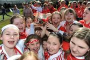 4 May 2008; Young Cork supporters celebrate with the cup. Suzuki Ladies National Football League, Division 1 Final, Cork v Kerry, Cusack Park, Ennis, Co. Clare. Picture credit: Ray McManus / SPORTSFILE