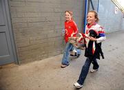 4 May 2008; Cork supporters Grainne Cahalane and Laura Cleary, both eight years old, from Castlehaven, carry the cup to the dressing room. Suzuki Ladies National Football League, Division 1 Final, Cork v Kerry, Cusack Park, Ennis, Co. Clare. Picture credit: Ray McManus / SPORTSFILE
