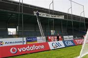 11 May 2008; Paddy Madden, under the watchful eyes of hotel manager Brendan Downes, erects a sign in favour of the Longford Arms Hotel before the game. GAA Football Leinster Senior Championship, Longford v Westmeath, Pearse Park, Longford. Picture credit: Ray McManus / SPORTSFILE