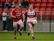 5 April 2015; Enda Lynn, Derry, in action against Tomas Clancy, Cork. Allianz Football League, Division 1, Round 7, Derry v Cork. Owenbeg, Derry. Picture credit: Oliver McVeigh / SPORTSFILE