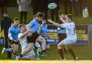 16 April 2015; Bobby Holland, UCD, is tackled by Nick McCarthy, left, and Angus Lloyd, Trinity. Annual Rugby Colours, UCD v Trinity. UCD Bowl, Belfield, Dublin. Picture credit: Pat Murphy / SPORTSFILE