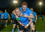 16 April 2015; UCD's Liam Bourke, top, and Conall Doherty celebrate after the game. Annual Rugby Colours, UCD v Trinity. UCD Bowl, Belfield, Dublin. Picture credit: Pat Murphy / SPORTSFILE