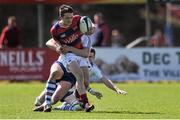 18 April 2015; Max MacFarlane, Clontarf, is tackled by Ned Hodson, Cork Constitution. Bateman Cup Final, Cork Constitution v Clontarf. Temple Hill, Cork. Picture credit: Eoin Noonan / SPORTSFILE