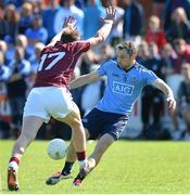 19 April 2015; Alan Brogan, Dublin, shoots to score the equalising point despite the tackle from Gary O'Donnell, Galway. Senior Football Challenge, Dublin v Galway, Skerries Harps GAA Clubhouse, Skerries  Co. Dublin. Picture credit: Ray Lohan / SPORTSFILE