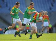 18 May 2008; J.J. Smith, Carlow, is tackled by Meath defenders Chris O'Connor, left, and Graham Reilly. GAA Football Leinster Senior Championship 1st Round, Meath v Carlow, Croke Park, Dublin. Picture credit: Ray McManus / SPORTSFILE