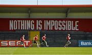 21 April 2015; Munster coaches, from left to right, strength and conditioning coach PJ Wilson, strength and conditioning coach Adam Sheehan, senior strength and conditioning coach Aidan O'Connell, and scrum coach Jerry Flannery, do some running after squad training. Irish Independent Park, Cork. Picture credit: Diarmuid Greene / SPORTSFILE