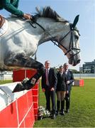 22 April 2015; Edward Butler, on CSF Whiterock Cruise, jump a puissance wall as Simon Coveney TD, Minister for Agriculture, Food, the Marine and Defence, Elizabeth Mair, Special Olympics Ireland Athlete, and Tom Hayes, T.D., Minister of State at the Department of Agriculture, Food and the Marine, look on at the launch of 'Jumping In The City' which will take place in greyhound stadia in Limerick, Cork and Dublin on Friday nights during the month of June. Shelbourne Park, Dublin. Picture credit: Ray McManus / SPORTSFILE