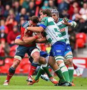 25 April 2015; CJ Stander, Munster, is tackled by Matteo Zanusso, left, and Rupert Harden, Benetton Treviso. Guinness PRO12, Round 20, Munster v Benetton Treviso. Irish Independent Park, Cork. Picture credit: Ramsey Cardy / SPORTSFILE
