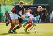 25 April 2015; Alister Smith, Bandon, in action against Luke Hayden, left, and Gareth Borland, Clontarf. Menâ€™s Irish Hockey Trophy final, Bandon v Clontarf. Belfield, Dublin. Picture credit: Ray Lohan / SPORTSFILE