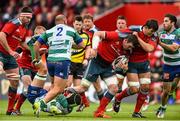 25 April 2015; Peter O'Mahony, supported by Donncha O'Callaghan, Munster, is tackled by Francesco Minto, Benetton Treviso. Guinness PRO12, Round 20, Munster v Benetton Treviso. Irish Independent Park, Cork. Picture credit: Ramsey Cardy / SPORTSFILE