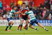 25 April 2015; Keith Earls, Munster, is tackled by Andrea Pratichetti , 12, and Edoardo Gori, Benetton Treviso. Guinness PRO12, Round 20, Munster v Benetton Treviso. Irish Independent Park, Cork. Picture credit: Eoin Noonan / SPORTSFILE