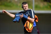 26 April 2015; Waterford manager Pat Sullivan puts on his bainisteoir bib before the game. TESCO HomeGrown Ladies National Football League, Division 3, Semi-Finals, Waterford v Roscommon. McDonagh Park, Nenagh, Co. Tipperary Picture credit: Diarmuid Greene / SPORTSFILE