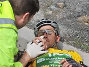 21 May 2008; Race leader Mark Cassidy, An Post sponsored Sean Kelly team, lies injured after a crash on the approach to Patrickswell, Co. Limeirck. FBD Insurance Ras 2008 - Stage 4, Corofin - Tralee. Picture credit: Stephen McCarthy / SPORTSFILE