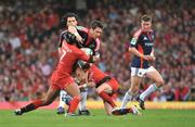 24 May 2008; David Wallace, Munster, is tackled by theirry Dusautoir, left, and Jean Baptiste Ellisalde, Toulouse. Heineken Cup Final, Munster v Toulouse, Millennium Stadium, Cardiff, Wales. Picture credit: Brendan Moran / SPORTSFILE