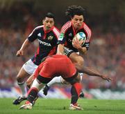 24 May 2008; Doug Howlett, Munster, is tackled by Maleli Kunavore, Toulouse. Heineken Cup Final, Munster v Toulouse, Millennium Stadium, Cardiff, Wales. Picture credit: Brendan Moran / SPORTSFILE