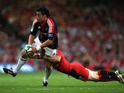24 May 2008; Lifeimi Mafi, Munster, is tackled by Jean Baptiste Elissalde, Toulouse. Heineken Cup Final, Munster v Toulouse, Millennium Stadium, Cardiff, Wales. Picture credit: Peter Morrison / SPORTSFILE
