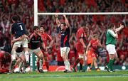 24 May 2008; Munster's David Wallace, centre, and team-mates Donncha O'Callaghan, left, and Marcus Horan celebrate at the final whistle. Heineken Cup Final, Munster v Toulouse, Millennium Stadium, Cardiff, Wales. Picture credit: Peter Morrison / SPORTSFILE