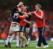 24 May 2008; Munster's Denis Hurley celebrates with backroom staff at the final whistle. Heineken Cup Final, Munster v Toulouse, Millennium Stadium, Cardiff, Wales. Picture credit: Oliver McVeigh / SPORTSFILE