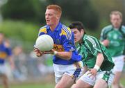 25 May 2008; George Hannigan, Tipperary, in action against Ger Collins, Limerick. GAA Football Munster Senior Championship Quarter-Final, Limerick v Tipperary, Fitzgerald Park, Fermoy, Co. Cork. Picture credit: Brian Lawless / SPORTSFILE