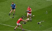 26 April 2015; A flock of pigeons fly away as Noel Gavin wins possession for Cork as his team mate Brian Hurley and Dublin's Jonny Cooper look on.  Allianz Football League, Division 1, Final, Dublin v Cork. Croke Park, Dublin. Picture credit: Ray McManus / SPORTSFILE