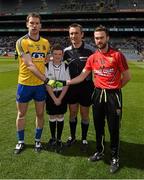 26 April 2015; Match referee Maurice Deegan with Oran Burke, St Joseph's National School, Fairview, and the two captains, Niall Carty, Roscommon, and Conor Laverty, Down, before the game. Allianz Football League, Division 2, Final, Down v Roscommon. Croke Park, Dublin. Picture credit: Ray McManus / SPORTSFILE