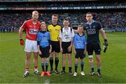 26 April 2015; The two captains Michael Shields, Cork, and Stephen Cluxton, Dublin, with match referee Pádraig Hughes, and mascots Adam Lambe, St. Lorcan's National School, Palmerstown, Conor Flanagan, Beann Eadair, Howth, and Sean Ryan, Trinity Gaels, Donaghmede, before the game. Allianz Football League, Division 1, Final, Dublin v Cork. Croke Park, Dublin. Picture credit: Ray McManus / SPORTSFILE