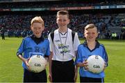 26 April 2015; Young referee Adam Lambe, St. Lorcan's National School, Palmerstown, with Conor Flanagan, Beann Eadair, Howth, and Sean Ryan, Trinity Gaels, Donaghmede, before the game. Allianz Football League, Division 1, Final, Dublin v Cork. Croke Park, Dublin. Picture credit: Ray McManus / SPORTSFILE