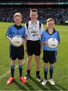 26 April 2015; Young referee Adam Lambe, St. Lorcan's National School, Palmerstown, with Conor Flanagan, Beann Eadair, Howth, and Sean Ryan, Trinity Gaels, Donaghmede, before the game. Allianz Football League, Division 1, Final, Dublin v Cork. Croke Park, Dublin. Picture credit: Ray McManus / SPORTSFILE