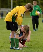 28 April 2015; Darragh Stakelum, Scoil Bhride, Thurles, Co. Tipperary, is consolded by Lisnagry N.S., Co. Limerick, goalkeeper William O'Leary after their Boys Section B Final. SPAR FAI Primary School 5's Munster Final, Active Ennis Sports & Amenity Park, Lees Road, Ennis, Clare. Picture credit: Diarmuid Greene / SPORTSFILE