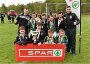 28 April 2015; The Lisnagry N.S., Co. Limerick, team, accompanied by teachers Micheal Feeney, left, and Shane McGrath, celebrate with the cup after victory over Scoil Bhride, Thurles, Co. Tipperary, in their Boys Section B Final. SPAR FAI Primary School 5's Munster Final, Active Ennis Sports & Amenity Park, Lees Road, Ennis, Clare. Picture credit: Diarmuid Greene / SPORTSFILE