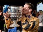 28 April 2015; Jockey Danny Mullins kisses The Blessington Cup after victory in the BoyleSports Champion Steeplechase on Felix Yonger. Punchestown Racecourse, Punchestown, Co. Kildare. Picture credit: Matt Browne / SPORTSFILE