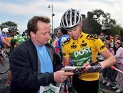 25 May 2008; FBD Insurance Ras 2008 winner Stephen Gallagher, An Post sponsored Sean Kelly team, signs an autograph for a supporter after the race. FBD Insurance Ras 2008 - Stage 8, Newbridge - Skerries. Picture credit: Stephen McCarthy / SPORTSFILE