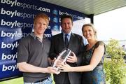 25 May 2008; Pat Downes receives the trophy from Irish Soccer International Paul McShane and Aisling Fennin from  Boylesports after the Boylesports.com Handicap. The Curragh Racecourse, Co. Kildare. Picture credit: Matt Browne / SPORTSFILE