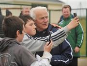 27 May 2008; Republic of Ireland manager Giovanni Trapattoni poses for photographs on mobile phones with children at the end of squad training. Republic of Ireland squad training, Gannon Park, Malahide, Co. Dublin. Picture credit: David Maher / SPORTSFILE *** Local Caption ***