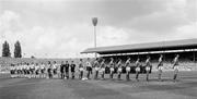 12 June 1988; The two teams and match officials stand for the National Anthems. Republic of Ireland, from right to left, Tony Galvin, Mick McCarthy, Kevin Moran, Chris Hughton, John Aldridge, Ray Houghton, Chris Morris, Ronnie Whelan, Paul McGrath, Packie Bonner and captain Frank Stapleton. Centre, from right to left, linesman Klaus Peschel, referee Siegfried Kirschen and linesman Manfred Rossner, all from East Germany. England, from right to left, captain Bryan Robson, Peter Shilton, Gary Stevens, Kenny Samson, Mark Wright, John Barnes, Tony Adams, Chris Waddle, Neil Webb, Peter Beardsley and Gary Lineker prior to the UEFA European Football Championship Finals Group B match between England and Republic of Ireland at Neckarstadion in Stuttgart, Germany. Photo by Ray McManus/Sportsfile