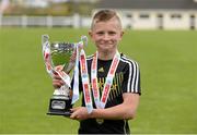 29 April 2015; Kyle Conway, captain of Cloonakilla NS, Athlone, Co. Roscommon, lifts the cup after winning the Boys section B Final. SPAR FAI Primary School 5's Connacht Finals. Milebush Park, Castlebar, Mayo. Picture credit: Diarmuid Greene / SPORTSFILE