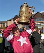 29 April 2015; Jockey Paul Carberry lifts thethe Bibby Financial Services Ireland Punchestown Gold Cup after victory on Don Cossack. Punchestown Racecourse, Punchestown, Co. Kildare. Picture credit: Matt Browne / SPORTSFILE
