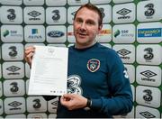 29 April 2015; Republic of Ireland head coach Tom Mohan, with the full squad list, following the squad announcement. Maldron Hotel, Dublin Airport, Dublin. Picture credit: Stephen McCarthy / SPORTSFILE