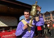 30 April 2015; Jockey Patrick Mullins with the FBD Cross Country Steeplechase for the La Touche Cup after victory on Uncle Junior. Punchestown Racecourse, Punchestown, Co. Kildare. Picture credit: Matt Browne / SPORTSFILE