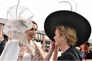 1 May 2015; Rachel Coyne, left, Mulligar, admires the hat of friend Katie Murphy, Mulligar. Punchestown Racecourse, Punchestown, Co. Kildare. Picture credit: Cody Glenn / SPORTSFILE
