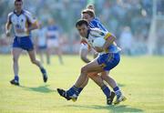 31 May 2008; Mick McLoughlin, Wicklow, in action against Ross Munnelly, Laois. GAA Football Leinster Senior Championship Quarter-Final, Wicklow v Laois, Dr Cullen Park, Carlow. Picture credit: Matt Browne / SPORTSFILE