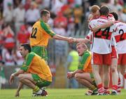 1 June 2008; Dejected Donegal players Rory Kavanagh, left and Neil Gallagher look on as Derry players, Fergal Doherty and Francis McEldowney, no. 24, celebrate at the end of the game. GAA Football Ulster Senior Championship Quarter-Final, Donegal v Derry, MacCumhaill Park, Ballybofey, Co. Donegal. Picture credit: David Maher / SPORTSFILE