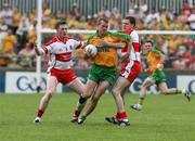 1 June 2008; Neil McGee, Donegal, in action against Joe Diver and Enda Muldoon, Derry. GAA Football Ulster Senior Championship Quarter-Final, Donegal v Derry, MacCumhaill Park, Ballybofey, Co. Donegal. Picture credit: Oliver McVeigh / SPORTSFILE