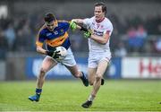 2 May 2015; Jason Lonergan, Tipperary, is tackled by Kieran McGeary, Tyrone. EirGrid GAA All-Ireland U21 Football Championship Final, Tipperary v Tyrone. Parnell Park, Dublin. Picture credit: Ramsey Cardy / SPORTSFILE