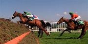 3 May 2000; Dorans Pride with Barry Geraghty up, wearing green silks, jumps the last ahead of Boss Doyle, with DJ Casey up, right, during The Punchestown Heineken Gold Cup at Punchestown Racecourse in Kildare. Photo by Matt Browne/Sportsfile