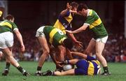 19 July 1992; Noel Roche, 10, and Tom Morrissey of Clare in action against Noel O'Mahony, 8, and Anthony Glesson of Kerry during the Munster Senior Football Championship Final match between Clare and Kerry at the Gaelic Grounds in Limerick. Photo by Ray McManus/Sportsfile