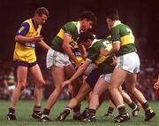 19 July 1992; Noel Roche, right,  and Tom Morrissey of Clare in action against Noel O'Mahony, left, Sean Burke, centre, and Anthony Glesson of Kerry during the Munster Senior Football Championship Final match between Clare and Kerry at the Gaelic Grounds in Limerick. Photo by Ray McManus/Sportsfile