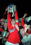 7 April 2000; Pat Scully of Shelbourne lifts the Eircom League Premier Division Trophy following the Eircom League Premier Division match between Waterford United and Shelbourne at the Regional Sports Centre in Waterford. Photo by Matt Browne/Sportsfile