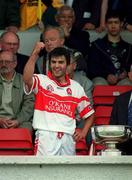9 July 2000; Conor Murray of Derry celebrates with the Liam Harvey Cup following the Guinness Ulster Hurling Championship Final match between Derry and Antrim at Casement Park in Belfast. Photo By Aoife Rice/Sportsfile